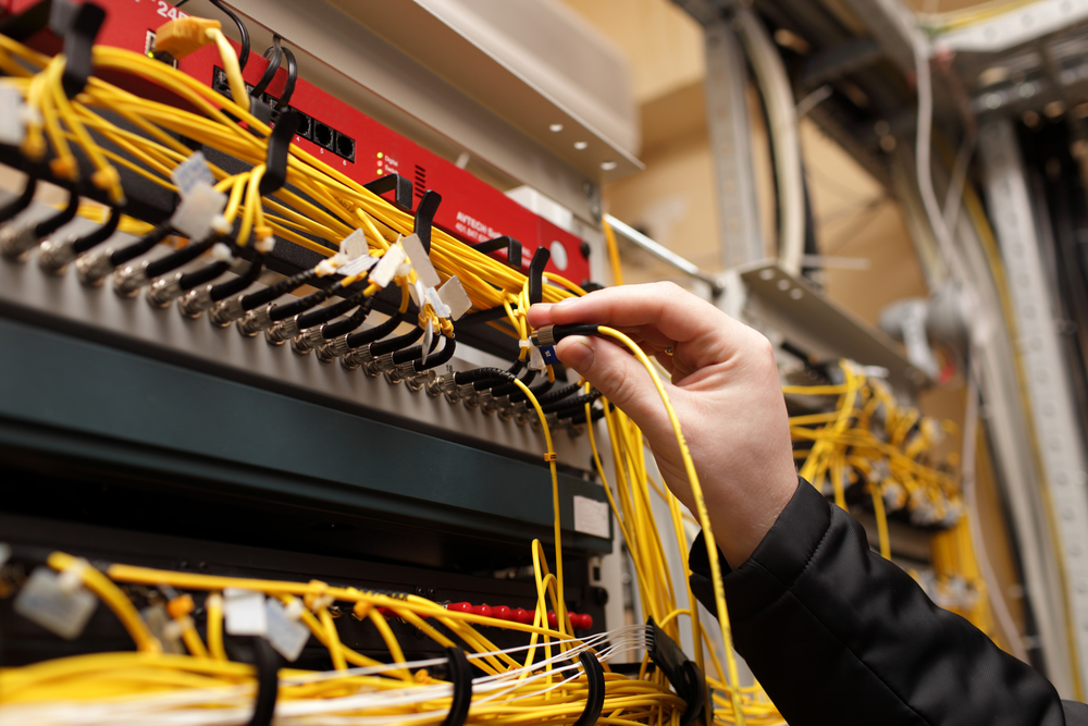 The,Technician,Attaching,Fiber,Optic,On,The,Telecom,Site